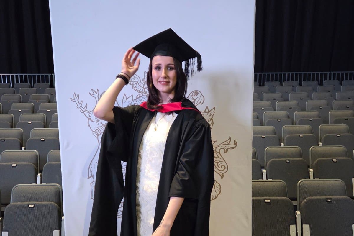 Emma in her graduation gown at the University of Derby