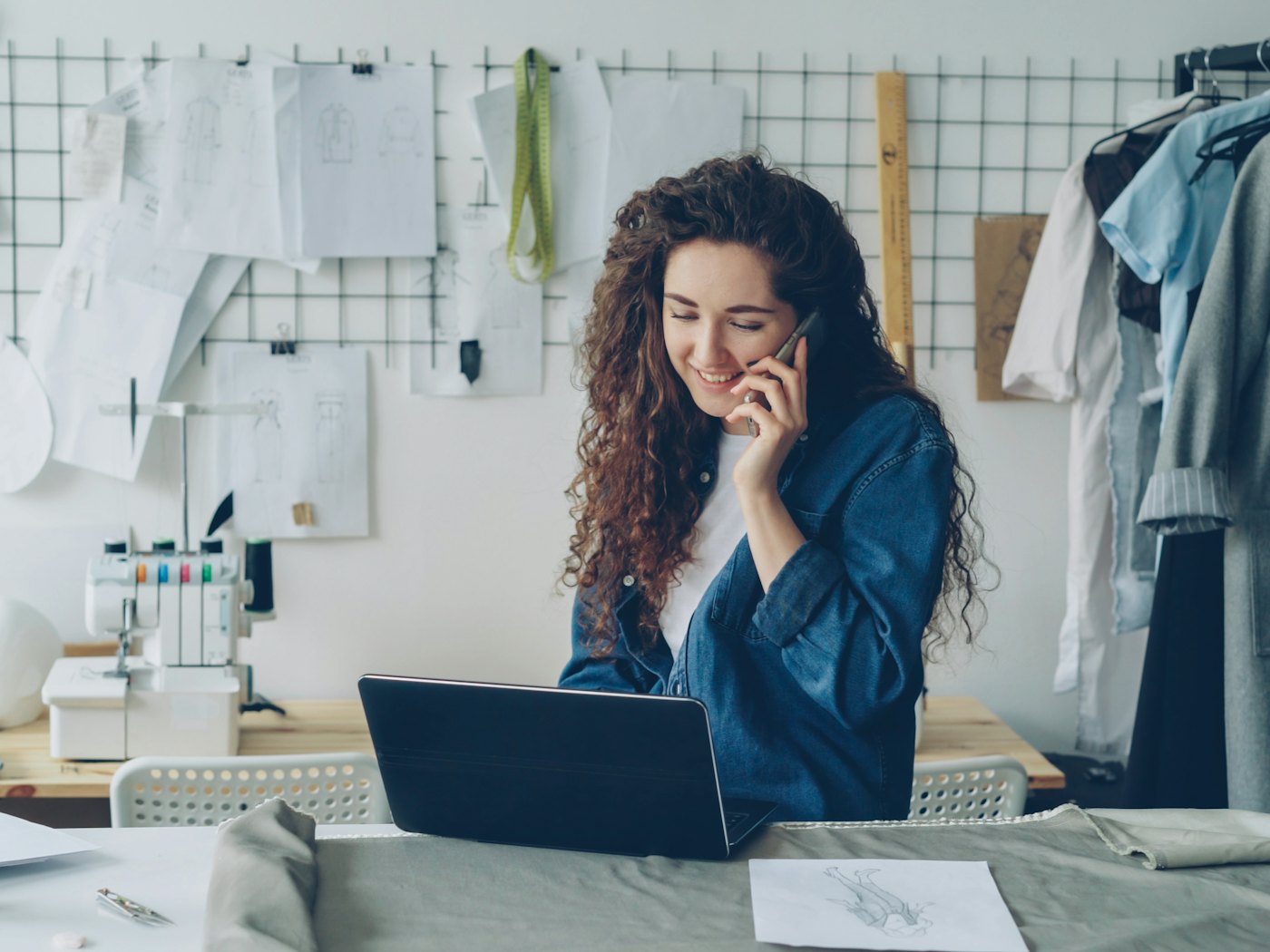 A business owner taking a call at her desk