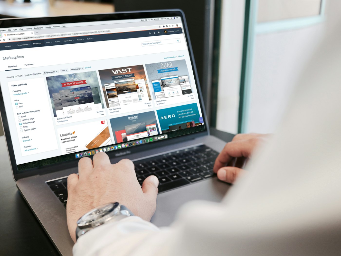 Someone browsing a website on a laptop